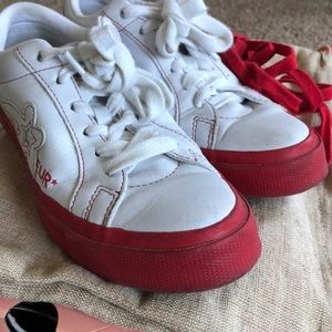 Red and White Low Top Golf Le Fleur Converse